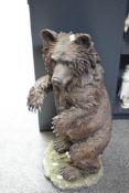 A large cast resin Brown Bear, having small damage to left hand and the back side, measuring 75cm