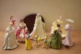 Four Royal Doulton bone china figurines comprising 'Fluer' HN 2368, 'Southern Belle' HN 2229, '