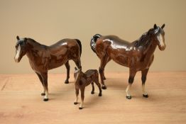 Three Beswick pottery horse studies comprising 'Swish Tail Horse' model number 1182 (Second Version)