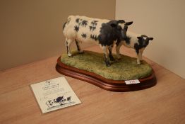 A Border Fine Arts limited edition figure group 'Belgian Blue Cow/Calf' model number B0590, modelled