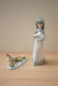 Two Nao by Lladro porcelain studies comprising 'Girl and Dog' model number 0118 and 'Hen with