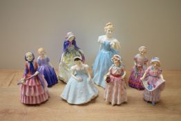A group of eight Royal Doulton bone china figurines comprising 'Enchantment' HN 2178, 'Marie' HN