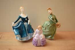 A group of three Royal Doulton bone china figurines comprising 'Rose' HN 2123, 'Janine' HN 2461