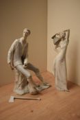 Two Spanish porcelain figures/figurines in the style of Lladro or Nao depicting a water carrier