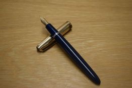A Parker VP button fill fountain pen in Blue with a Rolled Gold cap having a Parker 14CT nib. Some