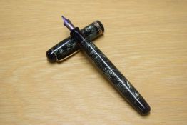 A Parker Televisor Standard button fill fountain pen in lined green with three gold cap bands having