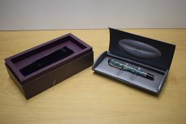 A boxed Parker Duofold Centennial converter fill fountain pen in Green Marble with one Broad and one