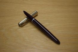 A Parker 51 aerometric fill fountain pen in Cordovan Brown with a Rolled Gold cap