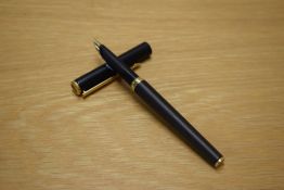 A Parker 95 cartridge fill fountain pen in Matte Black with gold trim having Parker nib