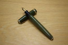 A Parker Duofold button fill fountain pen in Olive Green with wide decorative cap band having Parker