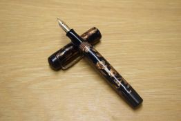 A Parker Duofold Junior button fill (presumed as it is to tight to open) in Black and Gold with