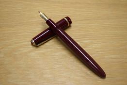 A Parker Victory aerometric fill fountain pen in Burgundy with decorative cap band having Parker 14K