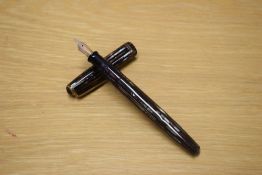 A Parker Duofold button fill fountain pen in striated Grey and Red with two gold bands to the cap