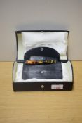 A boxed Conway Stewart Dinkie series cartridge converter fill fountain pen in Coral Green No620/