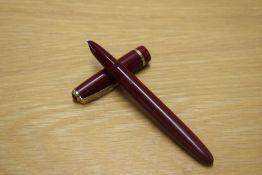 A Parker Lady aerometric fill fountain pen in Burgundy with decorative cap band.