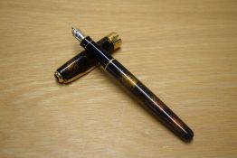 A Parker Sonnet Premiere converter fill fountain pen in Chinese Laque Vision Ambre (black and gold),