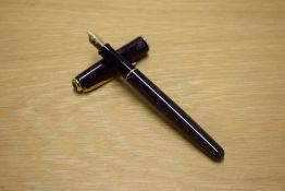 A Parker Sonnet Converter fill fountain pen in laque red with gold trim having Parker nib