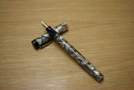 A Stephens 105 lever fill fountain pen in Pearl and Black with single narrow cap band having