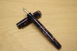 A Parker Duofold Special button fill fountain pen in Burgundy and Black marble with single narrow