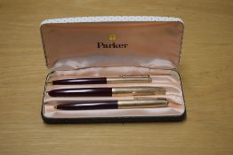 A boxed Parker 51 aerometric fountain pen, propelling pencil and ballpoint pen in Maroon with Rolled