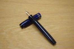 A Parker Duofold Junior button fill fountain pen in Lapis Lazuli Blue with two narrow bands to the