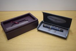 A boxed Parker Duofold Centennial converter fill fountain pen in Blue Marble with one Broad and