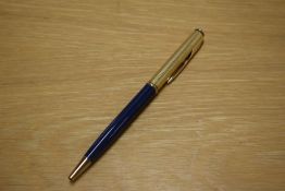 A Parker 75 Insignia ballpoint pen in in blue with custom gold plated cap