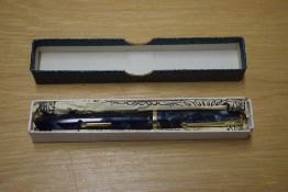 A boxed Conway Stewart 12 lever fill fountain pen in Blue Marble with Gold veining a single wide cap