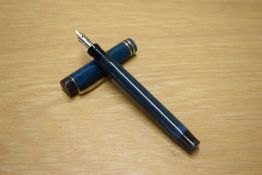 A Parker Duofold Lucky Curve button fill fountain pen in Blue Moire with two cap bands having Parker