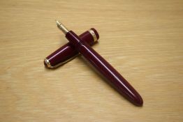 A Parker Duofold aerometric fill fountain pen in Burgundy with decorative cap band having Parker 14K