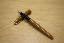 A Parker 35 aerometric fountain pen in Saffron with gold trim having Parker 750 nib