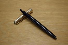 A Parker 61 Custom Insignia converter fill fountain pen in Black with Rolled Gold cap.