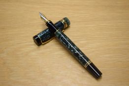 A Parker Duofold International converter fill fountain pen in Green Marble with one broad and one