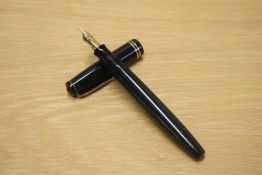A Parker Victory button fill fountain pen in Green with two narrow cap bands having Parker 14K Pen N