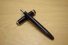A Parker Duofold button fill fountain pen in Dark Brown/Black with wide decorative cap band having