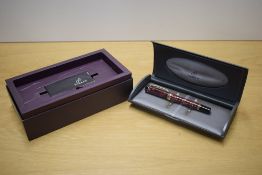 A boxed Parker Duofold Centennial converter fill fountain pen in Maroon Marble with one Broad and
