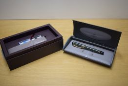 A boxed Parker Duofold Centennial converter fill fountain pen in Jade Green with two bands to the