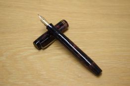 A Parker Duofold Senior button fill fountain pen in Burgundy and Black marble with two narrow cap