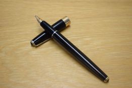 A Parker 17 aerometric fill fountain pen in Black with gold trim having 14K Parker England nib.