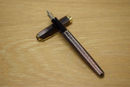 A Parker Sonnet converter fill fountain pen in Chiselled Chocolate with gold trim having Parker