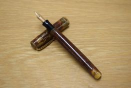 A Parker Moderne button fill fountain pen in Brown with single narrow band to the cap having