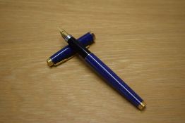 A Parker 75 converter fill fountain pen in Lapis Lazuli Blue with Gold trim having Parker 750 France