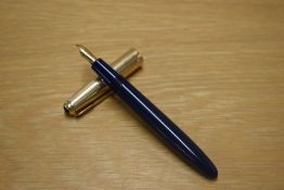 A Parker La Plume Double Or Lamine aerometric fill fountain pen in Blue with gold cap having