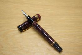 A Parker Duofold International converter fill fountain pen in Maroon Marble with five one broad