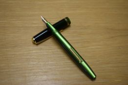 A Conway Stewart 570 lever fill fountain pen in Green with single wide cap band having Conway 14ct
