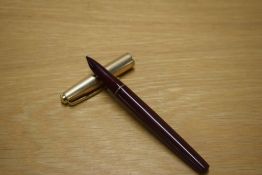 A Parker 51 aerometric fill fountain pen in Burgundy with a Rolled Gold cap