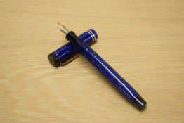 A Parker Duofold Special Senior Lucky Curve button fill fountain pen in Lapis Lazuli Blue with two
