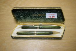 A boxed Conway Stewart 93 lever fill fountain pen and propelling pencil in Green Herringbone with