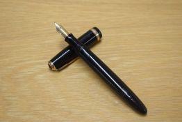 A Parker Duofold button fill fountain pen in Black with wide decorative cap band having Parker