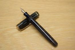 A Parker Moderne button fill fountain pen in Green and Gold with single narrow band to the cap